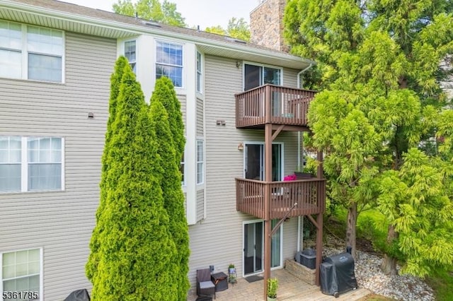 20 Pinehurst Dr, Washington Twp, NJ 07882 - rear view of house featuring a balcony and a chimney