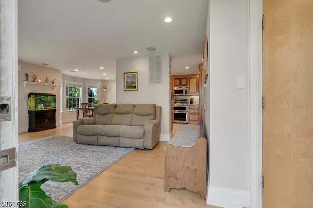 20 Pinehurst Dr, Washington Twp, NJ 07882 - living room featuring recessed lighting, light wood-type flooring, a fireplace, and baseboards