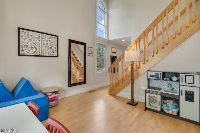 20 Pinehurst Dr, Washington Twp, NJ 07882 - staircase with wood finished floors, baseboards, and a towering ceiling
