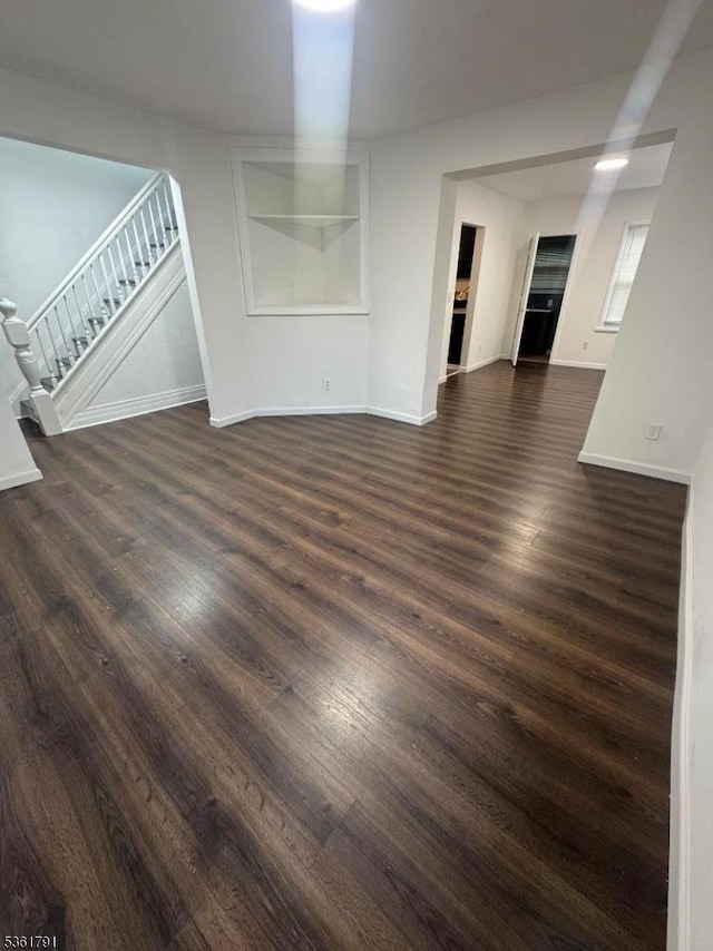 637 Union St, City Of Orange Twp, NJ 07050 - unfurnished living room featuring dark wood-style flooring and stairway