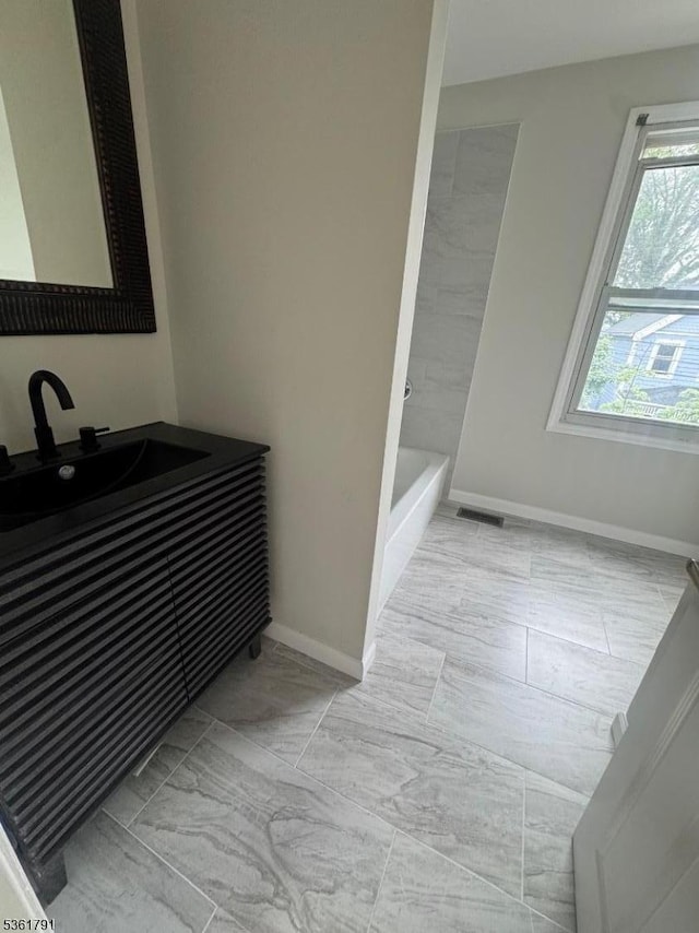 637 Union St, City Of Orange Twp, NJ 07050 - bathroom featuring vanity and a tub