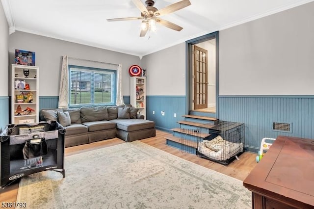 31 Center St, Netcong Boro, NJ 07857 - living room with wood finished floors, a ceiling fan, wainscoting, and ornamental molding
