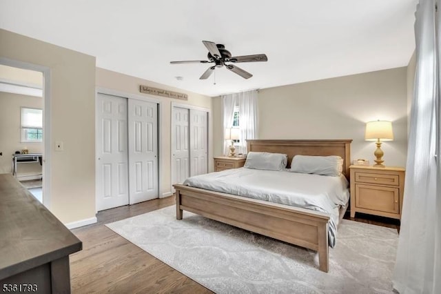 31 Center St, Netcong Boro, NJ 07857 - bedroom featuring multiple closets, wood finished floors, baseboards, and a ceiling fan