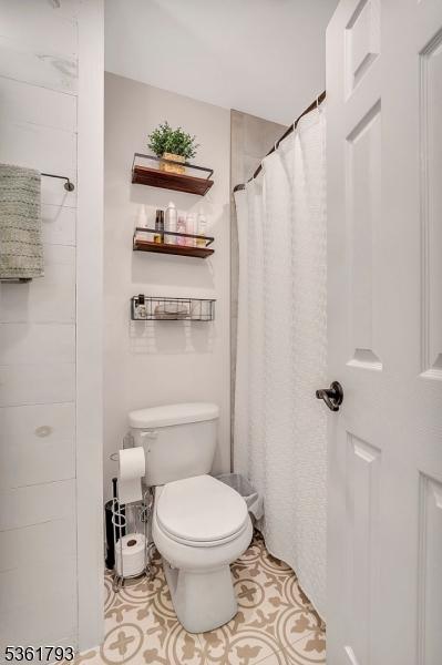 31 Center St, Netcong Boro, NJ 07857 - full bathroom with toilet and tile patterned floors