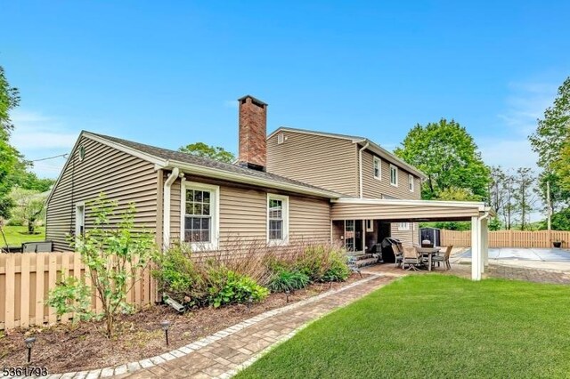 31 Center St, Netcong Boro, NJ 07857 - back of house with a patio area and a chimney