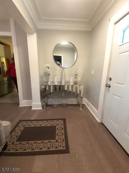 336 E 41st St, Paterson City, NJ 07504 - entrance foyer with baseboards, wood finished floors, and crown molding