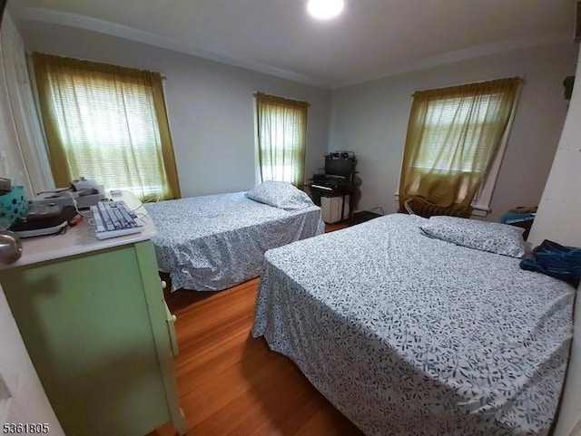 336 E 41st St, Paterson City, NJ 07504 - bedroom featuring light wood-type flooring and ornamental molding