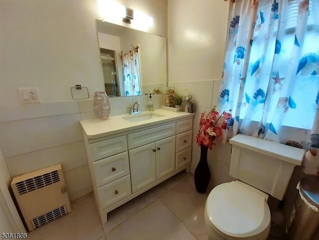 336 E 41st St, Paterson City, NJ 07504 - bathroom with toilet, tile patterned flooring, vanity, curtained shower, and radiator