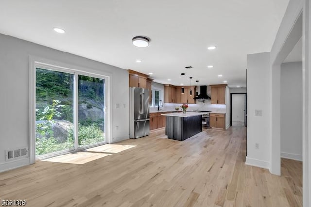 23 Meadow Ln, Sparta Twp, NJ 07871 - kitchen featuring appliances with stainless steel finishes, wall chimney exhaust hood, a center island, recessed lighting, and light countertops