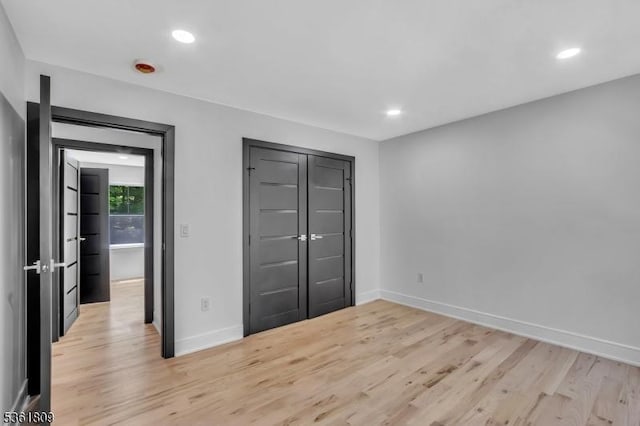 23 Meadow Ln, Sparta Twp, NJ 07871 - unfurnished bedroom featuring light wood-type flooring, recessed lighting, and a closet