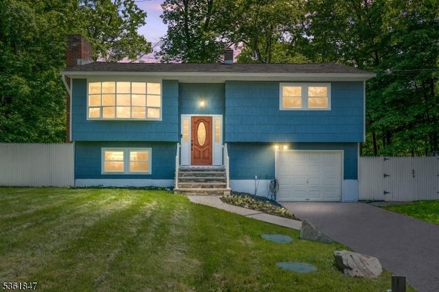 80 Cedar Tree Dr, Vernon Twp, NJ 07422 - bi-level home with driveway, an attached garage, and a chimney