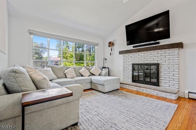 80 Cedar Tree Dr, Vernon Twp, NJ 07422 - living area featuring wood finished floors, high vaulted ceiling, and a fireplace