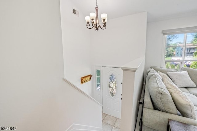80 Cedar Tree Dr, Vernon Twp, NJ 07422 - entrance foyer with light tile patterned floors, a chandelier, and baseboards