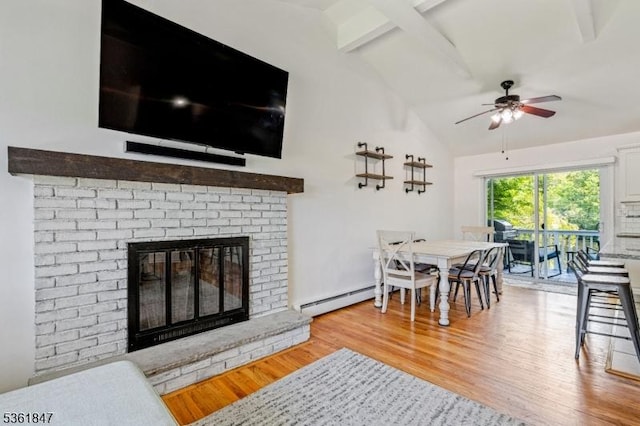 80 Cedar Tree Dr, Vernon Twp, NJ 07422 - living area featuring ceiling fan, light wood-style floors, beam ceiling, a brick fireplace, and baseboard heating