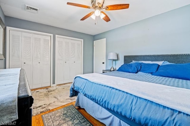 80 Cedar Tree Dr, Vernon Twp, NJ 07422 - bedroom with multiple closets, wood finished floors, and ceiling fan