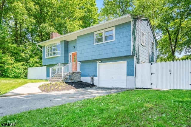 80 Cedar Tree Dr, Vernon Twp, NJ 07422 - split foyer home with an attached garage, a chimney, driveway, and a gate