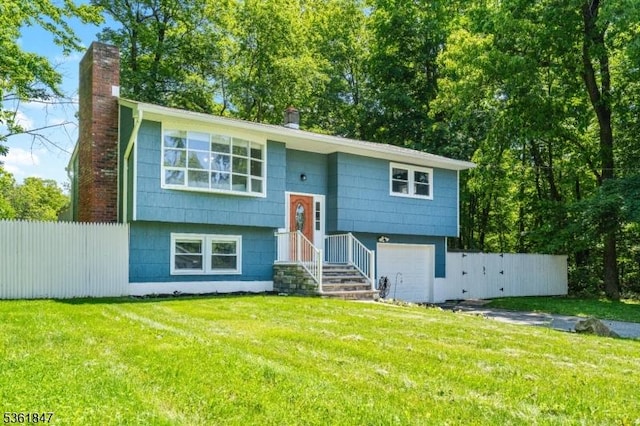 80 Cedar Tree Dr, Vernon Twp, NJ 07422 - split foyer home featuring an attached garage and a chimney