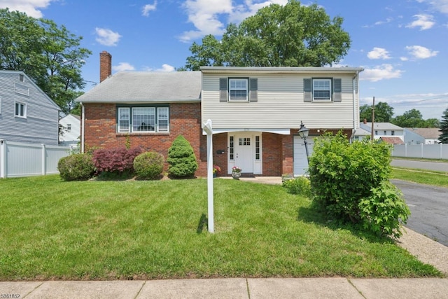 578 Winchester Ave, Union Twp, NJ 07083 - view of front facade with brick siding, a chimney, and an attached garage