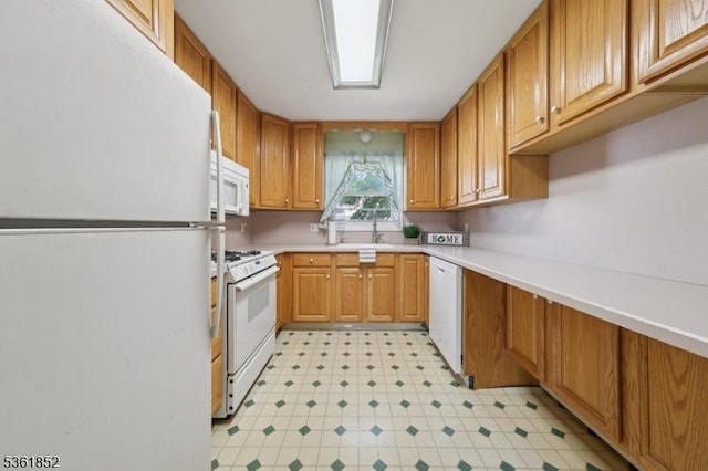 578 Winchester Ave, Union Twp, NJ 07083 - kitchen with white appliances, light countertops, and brown cabinetry