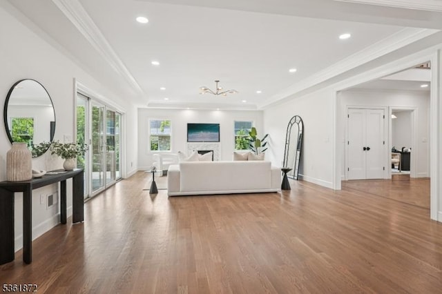 107 Rutland Rd, Glen Rock Boro, NJ 07452 - living room featuring light wood-style floors, a chandelier, recessed lighting, ornamental molding, and baseboards