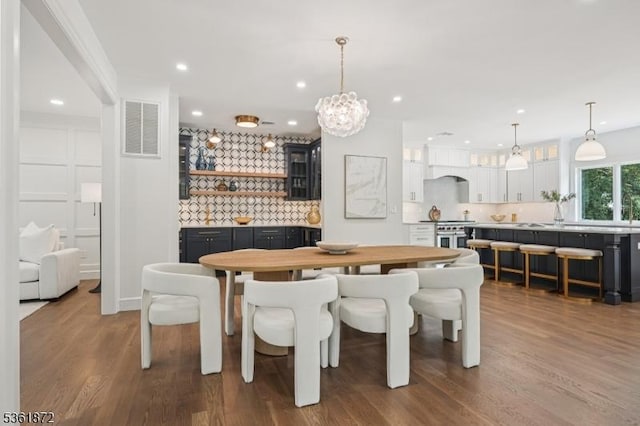 107 Rutland Rd, Glen Rock Boro, NJ 07452 - dining room featuring wood finished floors, a chandelier, and recessed lighting