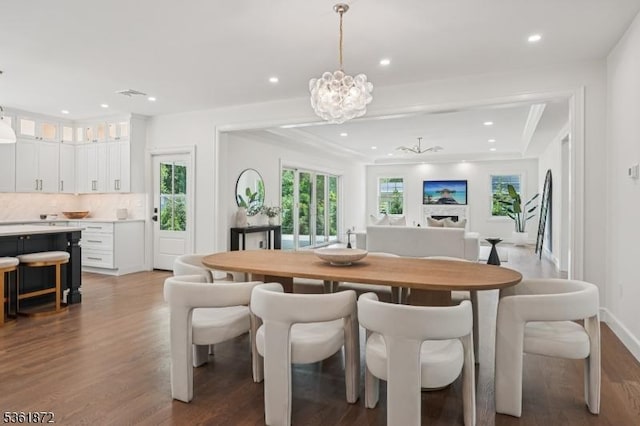 107 Rutland Rd, Glen Rock Boro, NJ 07452 - dining room with wood finished floors, recessed lighting, healthy amount of natural light, a chandelier, and baseboards