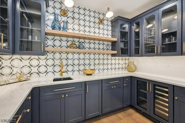 107 Rutland Rd, Glen Rock Boro, NJ 07452 - bar with wine cooler, decorative backsplash, and light wood-type flooring