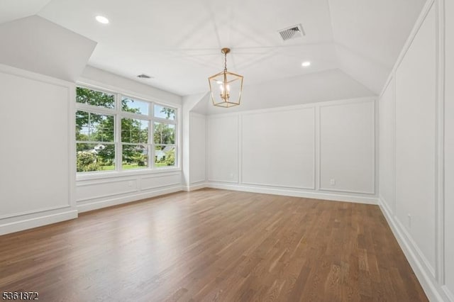 107 Rutland Rd, Glen Rock Boro, NJ 07452 - additional living space with a decorative wall, a chandelier, lofted ceiling, wood finished floors, and recessed lighting