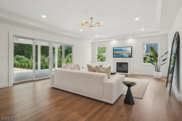 107 Rutland Rd, Glen Rock Boro, NJ 07452 - living area featuring a tray ceiling, wood finished floors, a fireplace, a chandelier, and recessed lighting