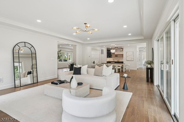 107 Rutland Rd, Glen Rock Boro, NJ 07452 - living area with a chandelier, wood finished floors, recessed lighting, baseboards, and crown molding