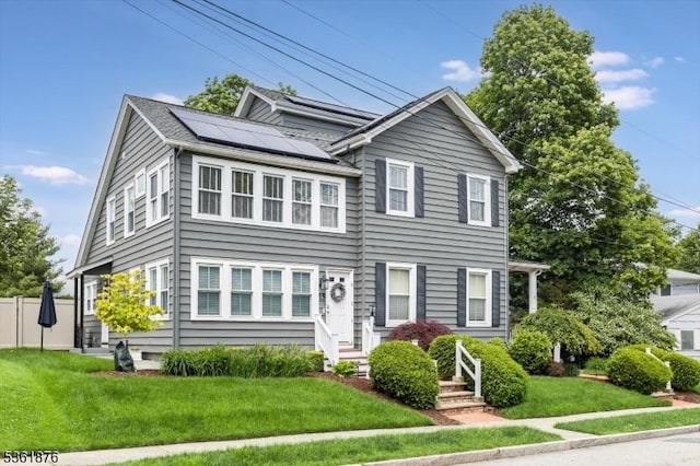15 Yantecaw Ave, Bloomfield Twp, NJ 07003 - view of front of property featuring solar panels and a front yard