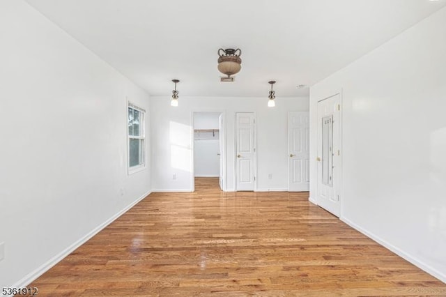 391 Lewis St, Franklin Twp, NJ 08873 - spare room with light wood-style floors and baseboards