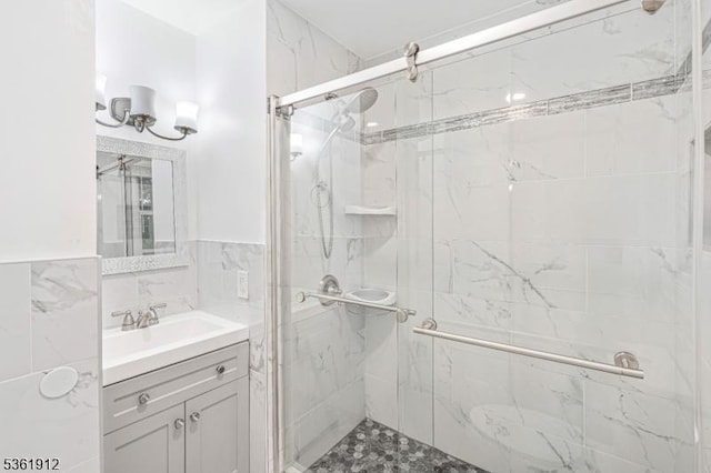 391 Lewis St, Franklin Twp, NJ 08873 - full bath featuring vanity, a marble finish shower, tile walls, and a wainscoted wall