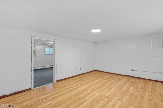 391 Lewis St, Franklin Twp, NJ 08873 - spare room featuring baseboard heating, light wood finished floors, and baseboards