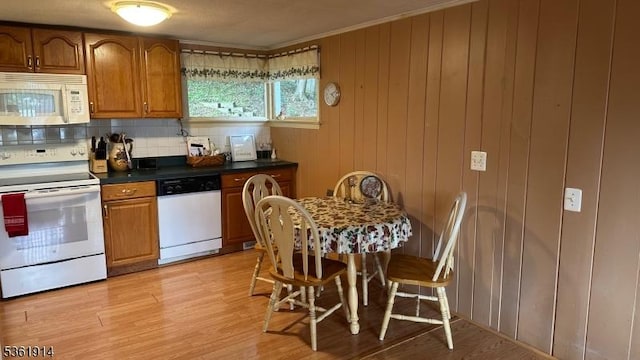 269 E Shore Trl, Sparta Twp, NJ 07871 - kitchen featuring white appliances, brown cabinetry, dark countertops, tasteful backsplash, and crown molding