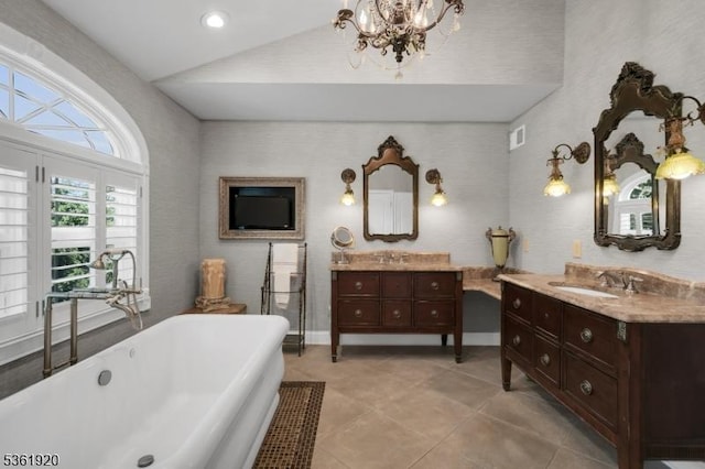 52 Independence Dr, Bernards Twp, NJ 07920 - bathroom with a soaking tub, a chandelier, two vanities, tile patterned flooring, and baseboards