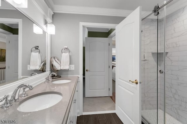 52 Independence Dr, Bernards Twp, NJ 07920 - bathroom featuring a shower stall, double vanity, wood finish floors, and crown molding