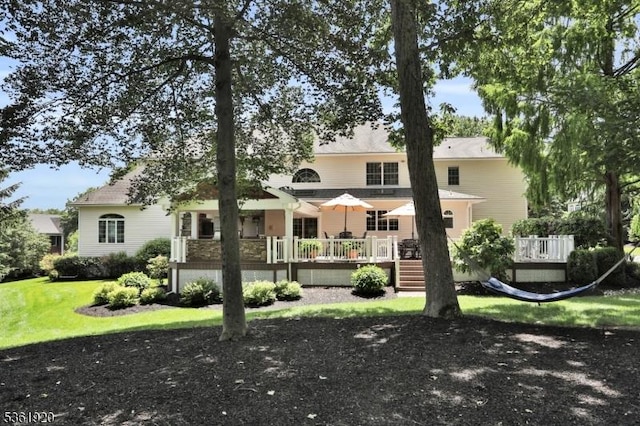 52 Independence Dr, Bernards Twp, NJ 07920 - back of property with a wooden deck and a lawn