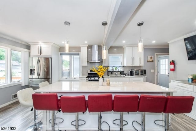 30 Filbert Ln, Union Twp, NJ 07083 - kitchen with wall chimney exhaust hood, appliances with stainless steel finishes, white cabinetry, healthy amount of natural light, and recessed lighting
