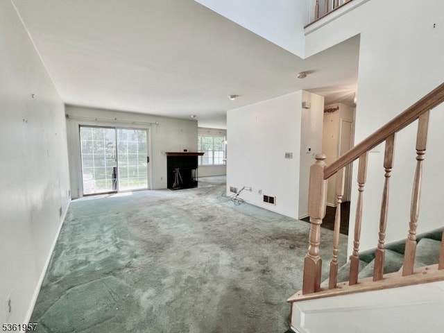 55 Weatherhill Rd, Hamburg Boro, NJ 07419 - unfurnished living room with carpet flooring, stairway, and baseboards