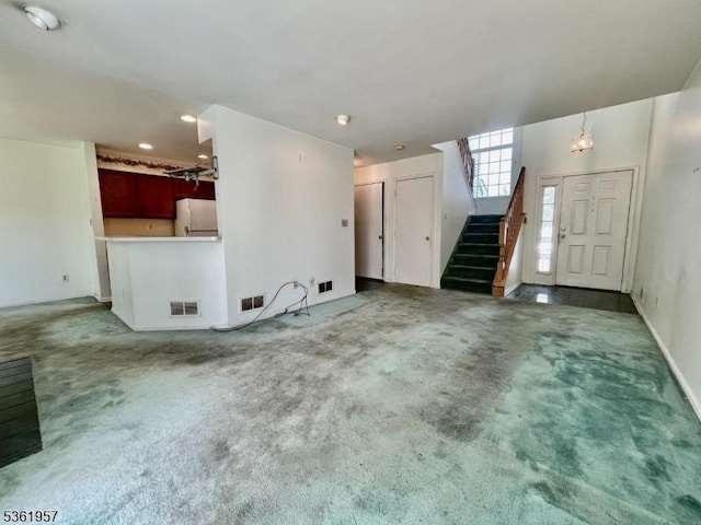 55 Weatherhill Rd, Hamburg Boro, NJ 07419 - unfurnished living room with carpet, stairs, and baseboards