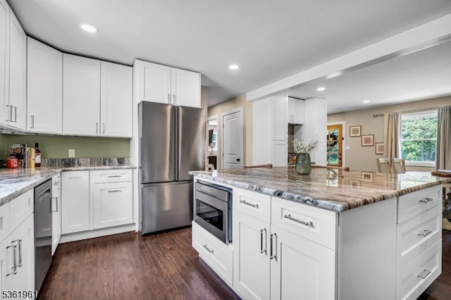 172 Ferry Rd, Delaware Twp, NJ 08822 - kitchen with stainless steel appliances, light stone countertops, recessed lighting, dark wood-type flooring, and white cabinets