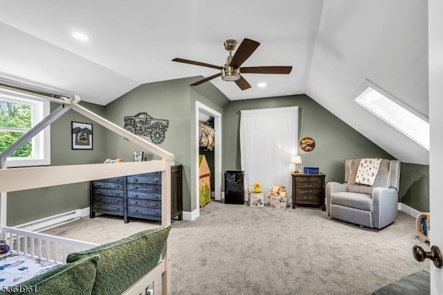 172 Ferry Rd, Delaware Twp, NJ 08822 - bedroom featuring vaulted ceiling, carpet floors, a ceiling fan, a skylight, and baseboard heating