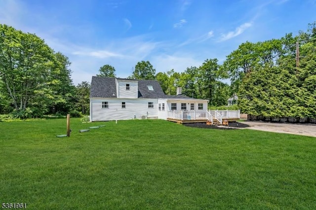 172 Ferry Rd, Delaware Twp, NJ 08822 - back of house featuring a deck and a lawn