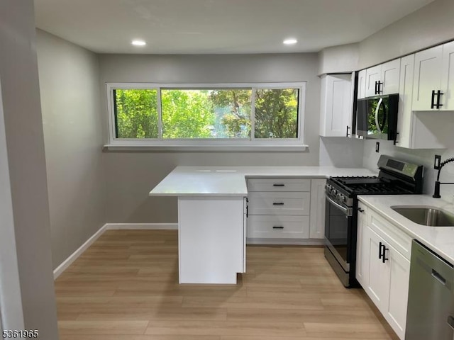 914 Merritt Dr Unit E, Hillsborough Twp, NJ 08844 - kitchen featuring appliances with stainless steel finishes, a sink, light countertops, healthy amount of natural light, and recessed lighting