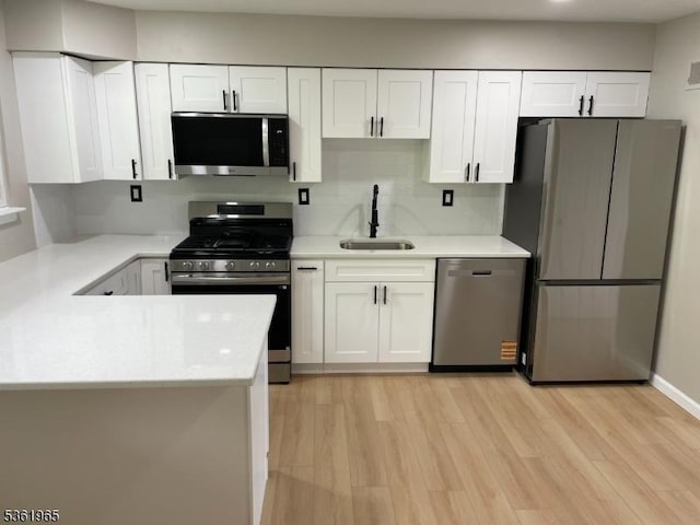 914 Merritt Dr Unit E, Hillsborough Twp, NJ 08844 - kitchen featuring appliances with stainless steel finishes, a sink, and light countertops