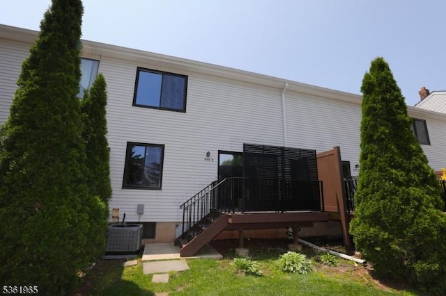 914 Merritt Dr Unit E, Hillsborough Twp, NJ 08844 - rear view of property with a wooden deck and central AC
