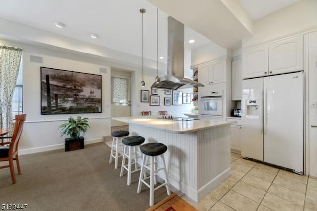 111 Mulberry St Unit Sky, Newark City, NJ 07102 - kitchen with white appliances, island exhaust hood, a center island, white cabinets, and light countertops