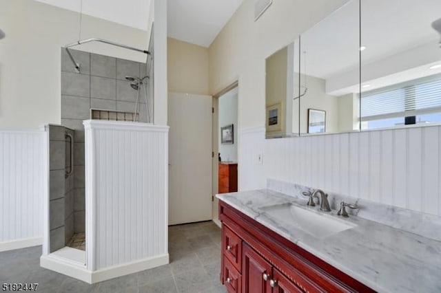 111 Mulberry St Unit Sky, Newark City, NJ 07102 - bathroom featuring vanity, a stall shower, and wainscoting