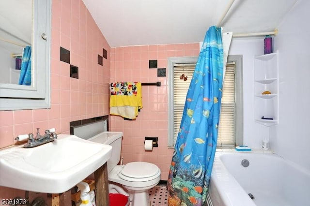267 Hoover Ave, Bloomfield Twp, NJ 07003 - bathroom featuring tile walls, a sink, toilet, and shower / bathtub combination with curtain